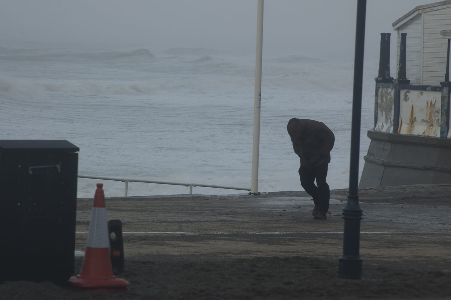 CE Aberystwyth storms man on the promenade battling the high winds